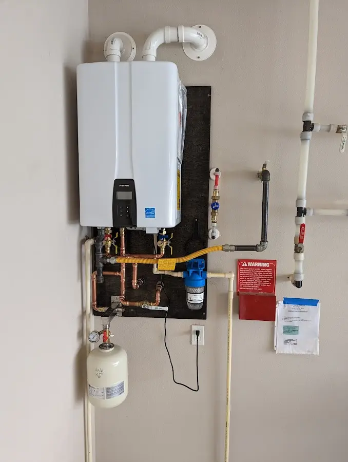 Professional plumber installing copper piping in a East Pennsboro home